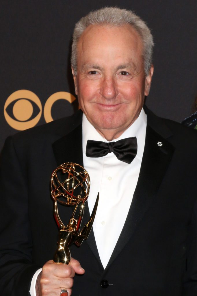 Lorne Michaels, TV writer and film producer, holding an Emmy award.