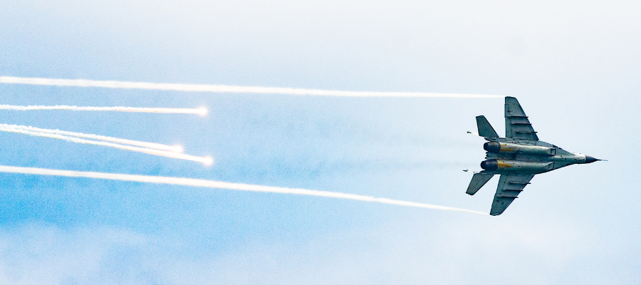 A jet races across a blue sky, representing Stockdale and the Stockdale Paradox