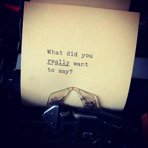 Paper in a typewriter with the text "What did you really want to say?"