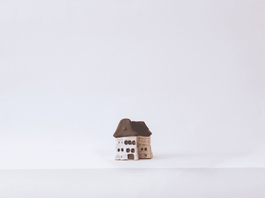 Miniature house sculpture, symbolizing the power of small