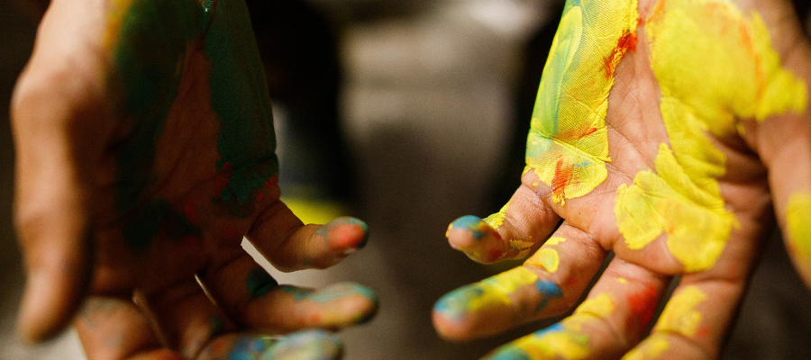 being your authentic self; paint covered hands facing upwards represent being your authentic self