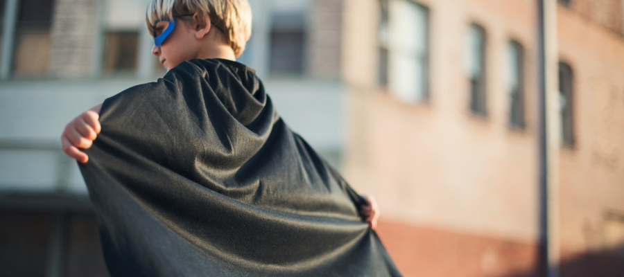 photo of a child wearing a blue superhero mask and a black batman cape represents getting your magic back